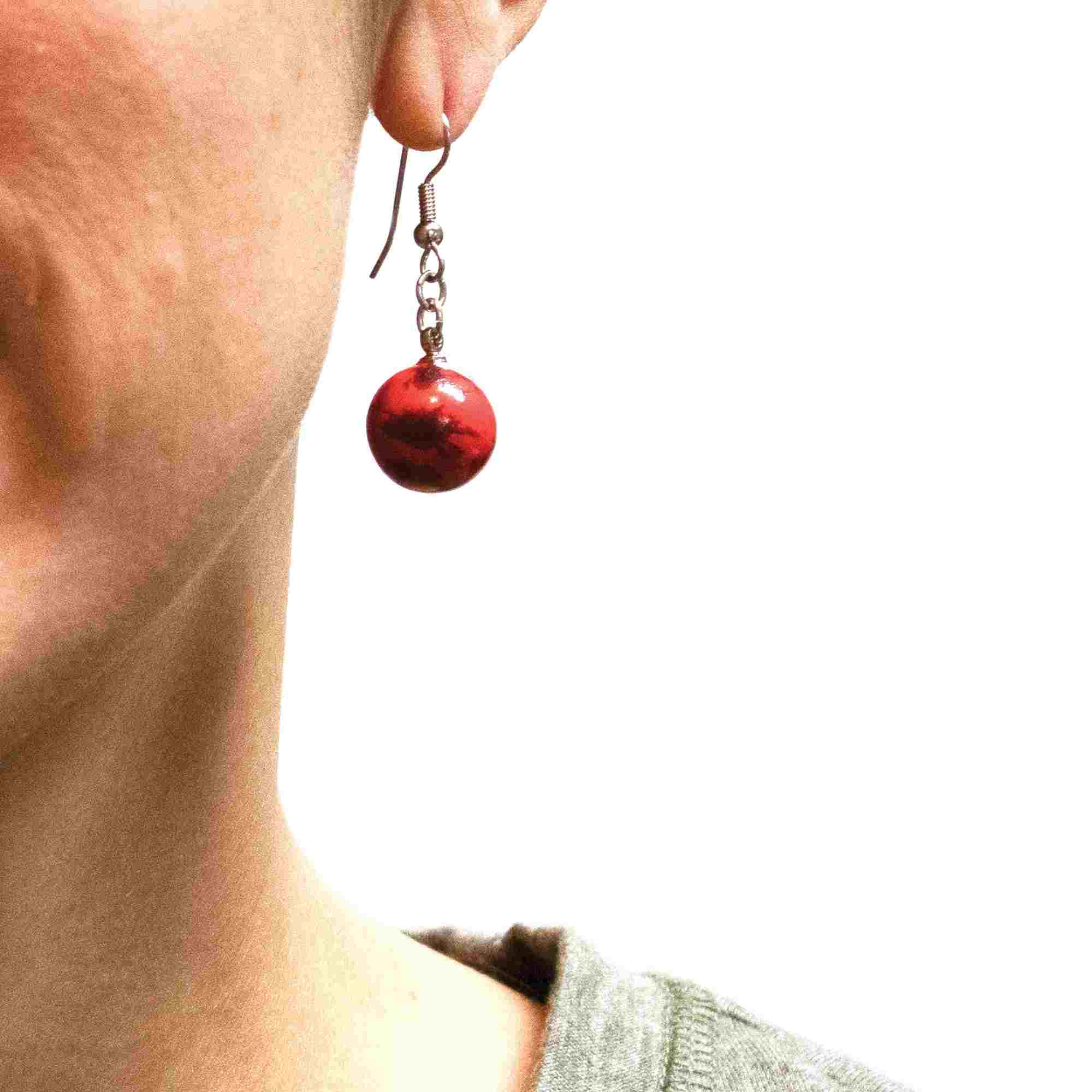 Mars earrings woman facing front
